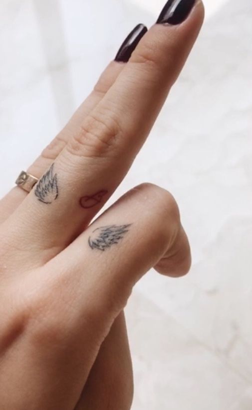 Angel Wings and Hand Tattoos