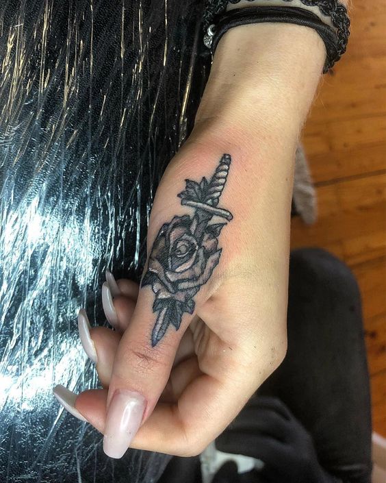 Rose and Dagger Hand Tattoo