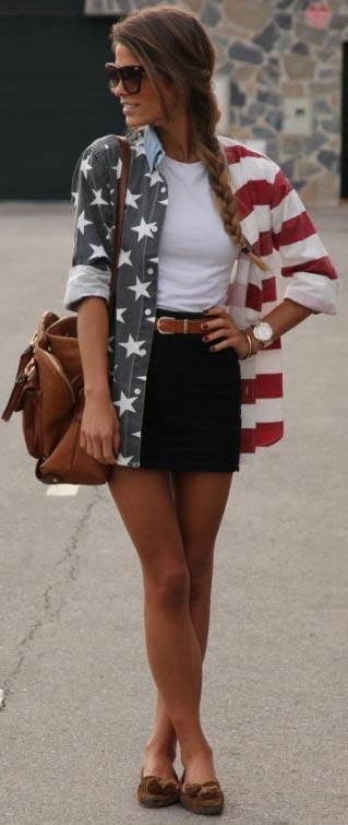 White crop top paired with cut-off shorts and a tie-around red and black flannel.