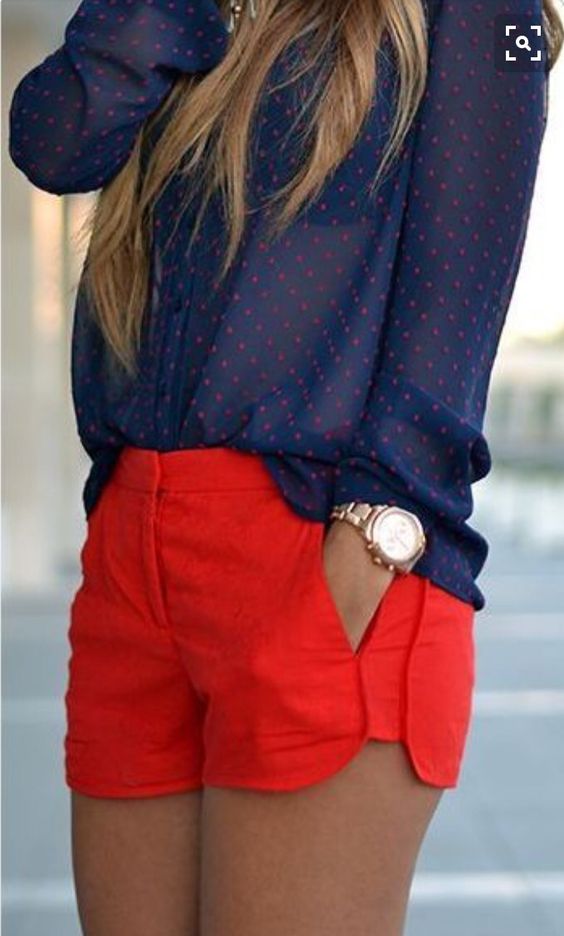 White crop top paired with cut-off shorts and a tie-around red and black flannel.