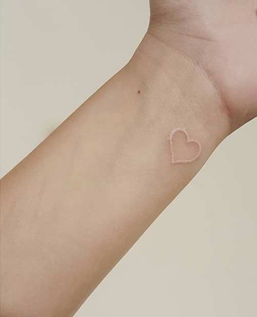 White Ink Heart Tattoo