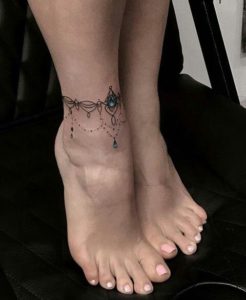 black-and-aquamarine-color-anklet-tattoo