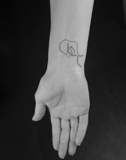 simple line elephant tattoo