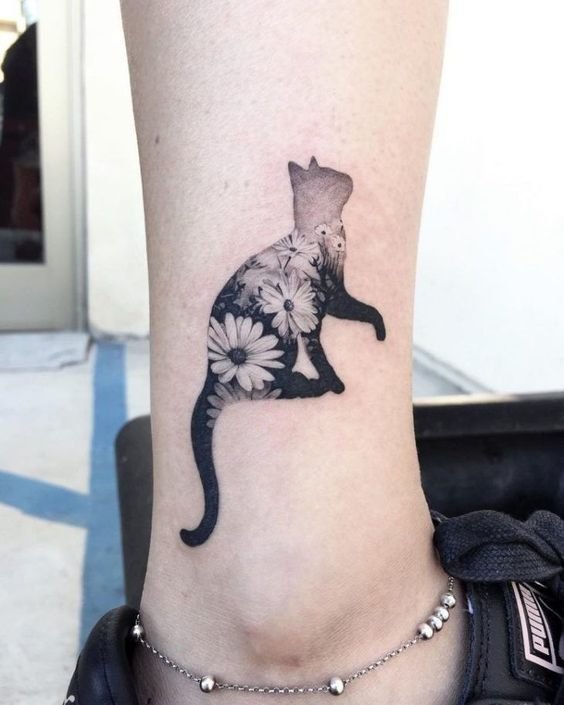 Download This creative tattoo uses a cat silhouette to incorporate ...